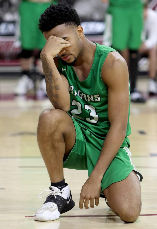 Harlan senior forward Jaedyn Gist took a moment to reflect after the Green Dragons suffered a one-point loss to Martin County in the All A Classic state tournament on Thursday. Gist was a starter on four straight Harlan teams that qualified for the small school state tournament.