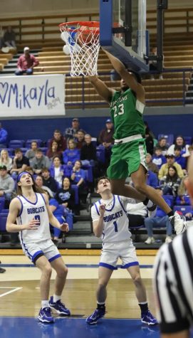 Harlan senior forward Jaedyn Gist slammed home two points in the Green Dragons 73-70 win Tuesday at Bell County.