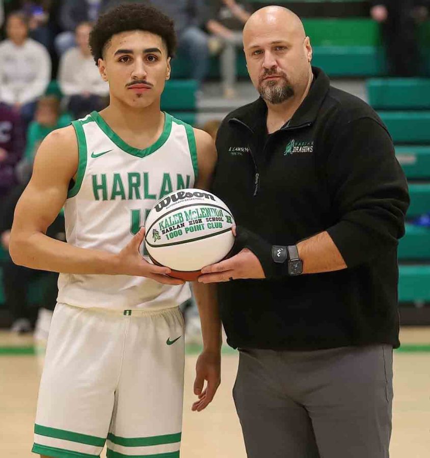 Harlan senior Kaleb McLendon was honored before the Green Dragons game Friday against Bell County for becoming a member of the schools 1,000-point club. He was presented a basketball by Harlan High School Principal Britt Lawson. McLendon currently ranks 16th, of the information we have on file, on the schools scoring list 