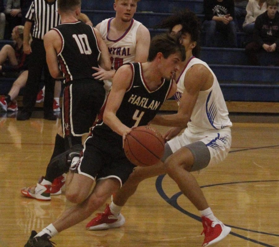 Harlan County senior guard Daniel Carmical worked around a Madison Central defender in Saturdays game at Rockcastle County. Carmical scored 15 in the Bears 70-46 loss.