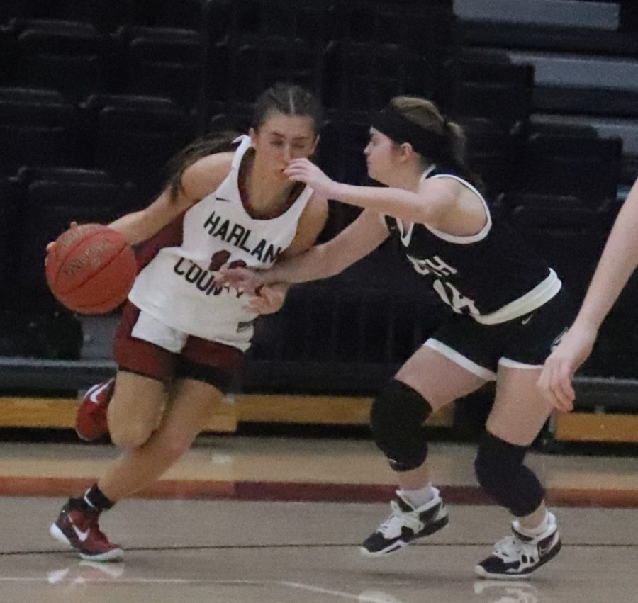 Harlan County guard Ella Karst worked to the basket against South Laurels Shelbie Mills in Tuesdays game. Mills scored 22 points to lead the Lady Cardinals in a 78-59 victory.