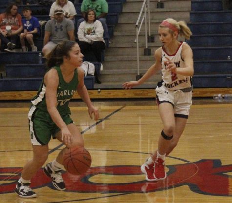 Harlan guard Emma Owens drove down the court against Rockcastle Countys Macy Spivey in Saturdays game at the Rocket Classic. Owens scored 22 points in the Lady Dragons 62-56 loss.
