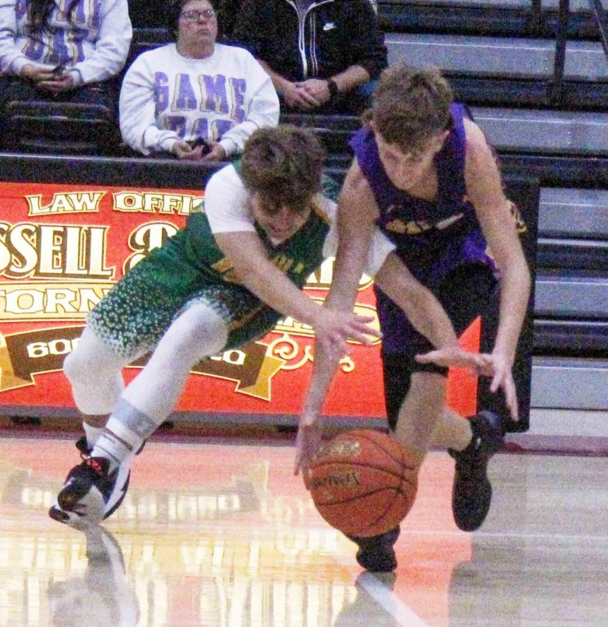 Green Hills Ethan Huff and Wallins Tanner Daniels battled for a loose ball in middle school basketball action earlier this season.