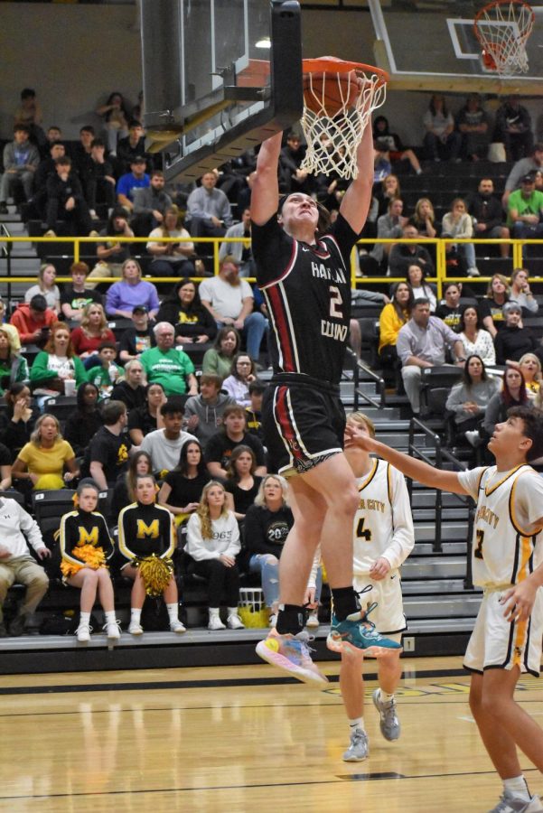 Harlan Countys Trent Noah went up to slam home two of his 21 points on Tuesday as the Black Bears overpowered Middlesboro in the 52nd District Tournament.