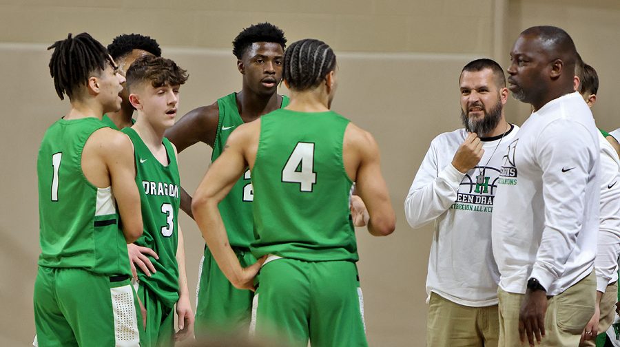 Harlan coach Derrick Akal, pictured talking with his team during a game earlier this season, was named the KABC Coach of the Year for the 13th Region after leading the Dragons to a 23-6 mark this season.