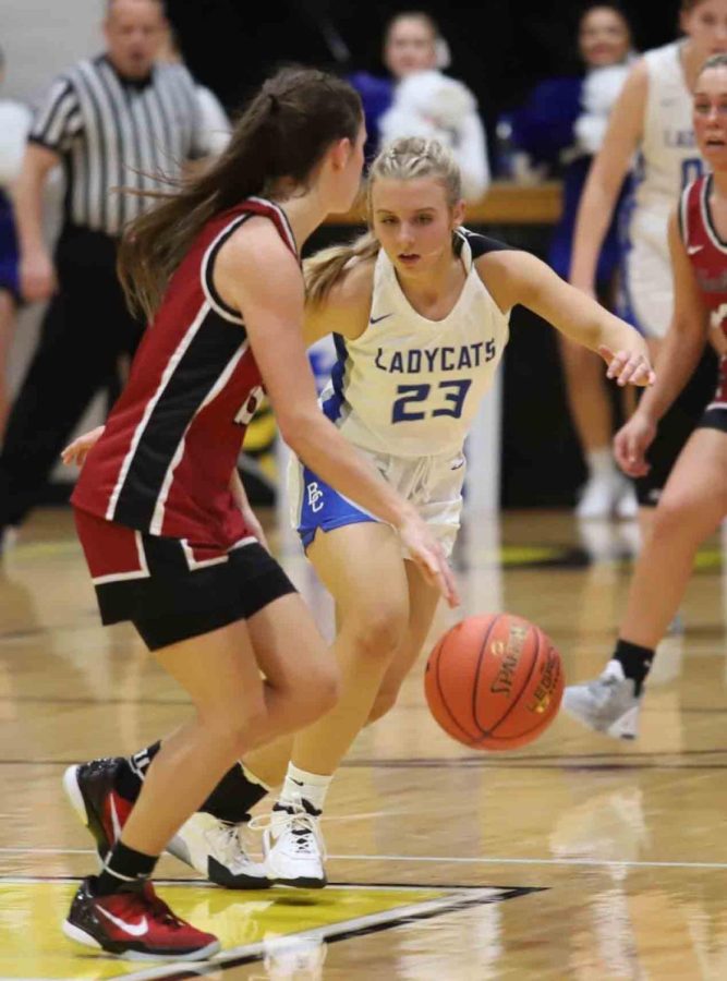 Harlan County guard Ella Karst worked against Bell Countys Mataya Ausmus in the 52nd District Tournament finals on Thursday.