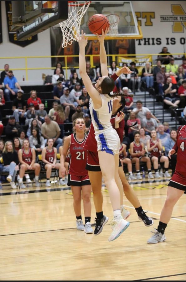 Bell County junior forward Gracie Wilder went up for a shot in the 52nd DIstrict Tournament finals Thursday against Harlan County. WIlder earned most valuable player honors as the Lady Cats rallied for a 48-44 victory.