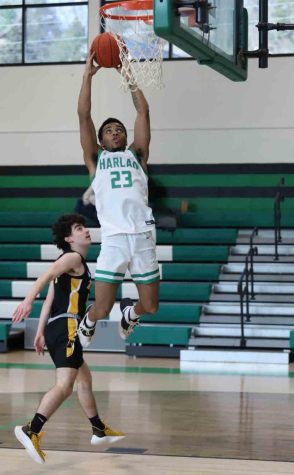 Harlan senior forward Jaedyn Gist went up for a dunk as part of his 27-point performance in the Green Dragons 110-78 win over visiting Clay County.