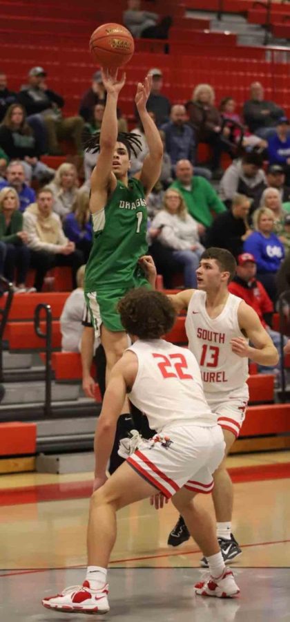 Harlan guard Kyler McLendon put up a shot in Saturdays game at South Laurel. McLendon led the Dragons with 23 points in a 57-39 loss.