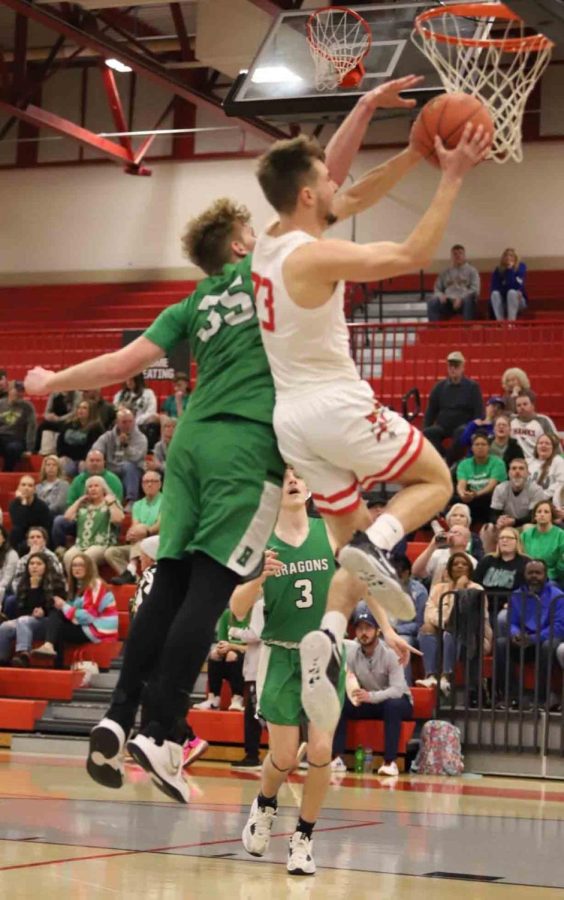 South Laurel guard Parker Payne went in for two of his 16 points in the Cardinals win over Harlan in London.