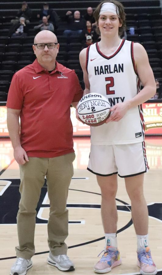 Harlan+County+junior+guard+Trent+Noah+was+honored+before+Tuesdays+game+against+Whitley+County+for+surpassing+the+2%2C000-point+and+1%2C000-rebound+marks.+Noah+was+presented+a+commemorative+basketball+by+coach+Kyle+Jones.