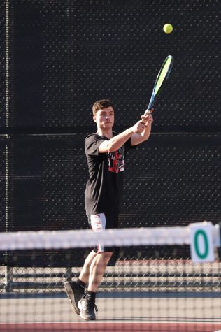 Harlan County senior Braden Engle, pictured in action earlier this season, was an 8-3 winner Friday against Whitley County as the Bears swept the boys and girls matches.