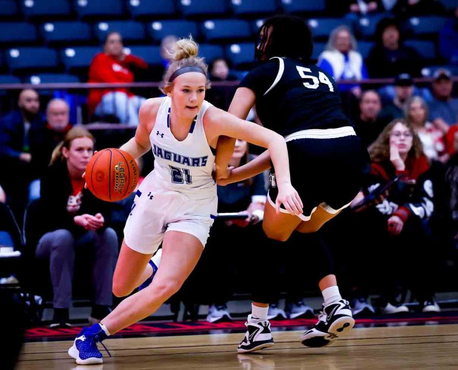 North Laurel guard Brooke Nichelson drove around South Laurels Peyton Mabe in 13th Region Tournament action Saturday. Nichelson scored 28 points in the Lady Jaguars 67-63 victory.