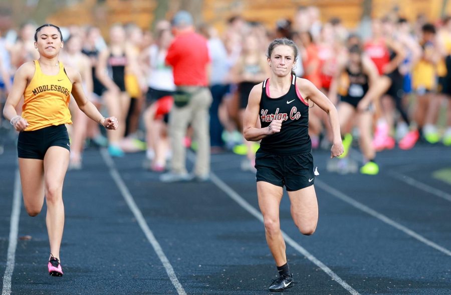 Harlan Countys Ella Karst, pictured in a meet earlier this season, won the 200-meter dash on Friday in the Coal Miners Memorial Invitational.