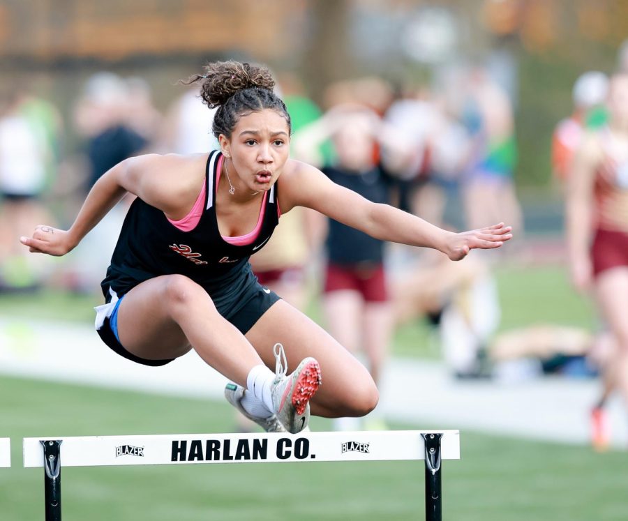 Harlan County High School junior Paige Phillips won the 100-meter hurdles, triple jump and high jump at the season-opening meet Friday at Coal Miners Memorial Stadium.