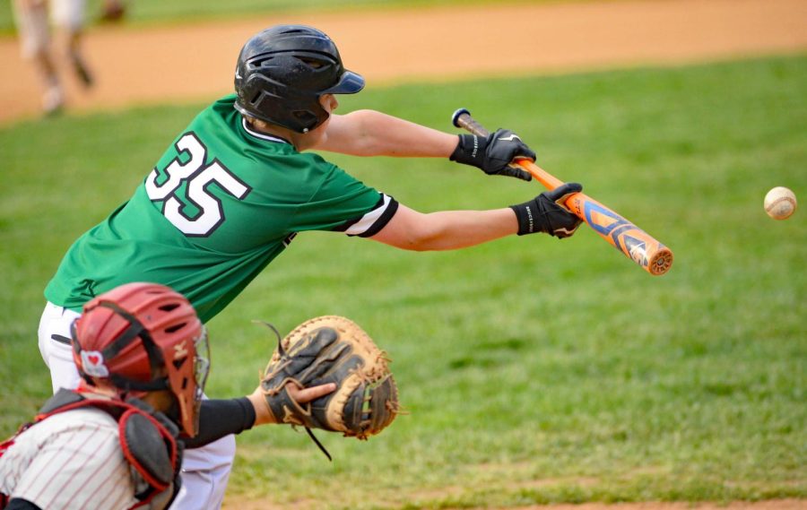 Harlans Eli Freyer squared around for a bunt in Tuesdays district clash at Harlan County.