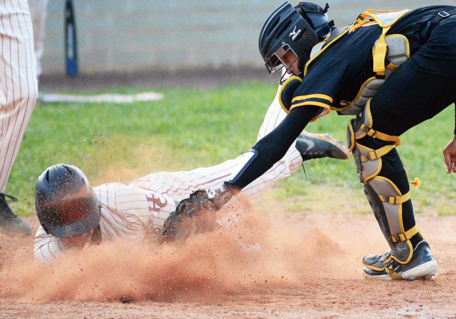 Harlan Countys Gunner Burkhart beat the tag of Middlesboro catcher Colt Bayless for a run in the fifth inning of the Bears 7-2 victory on Monday.