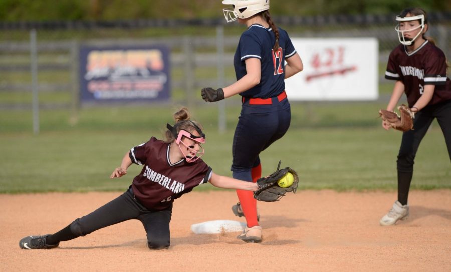 Harlan Countys Madi Nolan went into second ahead of the throw to Cumberlands Lexi Boggs in middle school softball action Thursday.