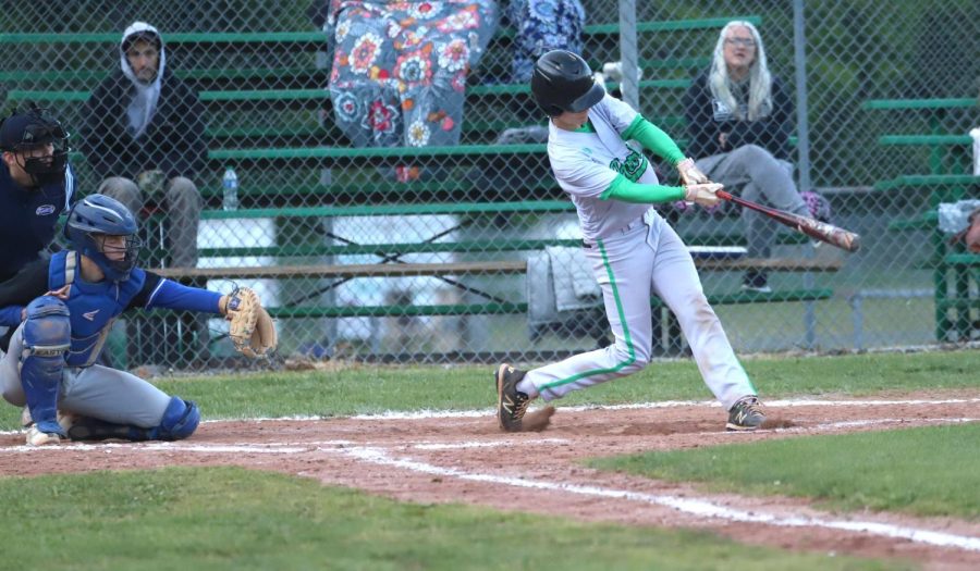 Harlans Brody Owens connected on a pitch in Mondays win over Bell County. The Green Dragons completed a sweep with a 9-5 victory Tuesday at Bell County.