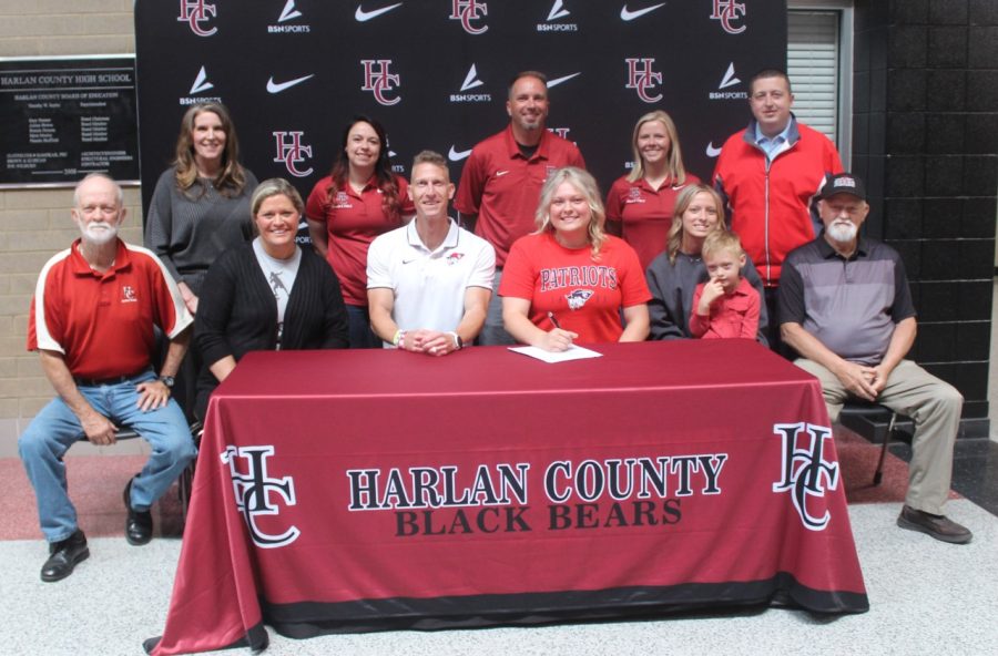 Taylor Lunsford signed with the University of the Cumberlands on Thursday. Pictured with Lunsford at the signing ceremony are, from left, front row: Bob Howard, Paige Lunsford, Cumberlands coach Bradley Sowder, Taylor Lunsford, Peyton Lunsford, Mitchel Lunsford and Tom Lunsford; back row: HCHS Principal Kathy Napier, coaches Miranda Epperson, Ryan Vitatoe, Baili Bailey and HCHS athletic director Eugene Farmer.