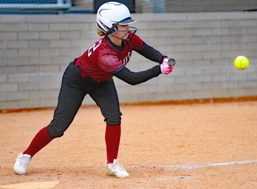 Harlan Countys Ryiie Maggard put down a bunt in Tuesdays game against Middlesboro. The Lady Bears rallied for an 8-7 victory.