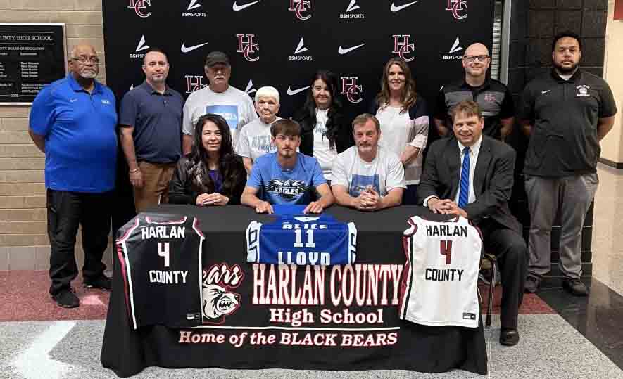 Harlan County senior guard Daniel Carmical signed with Alice Lloyd College on Monday to continue his academic/athletic career. Pictured with Carmical are, from left, front row: Carma Carmical, Stewart Carmical and Alice Lloyd coach Scott Cornett; back row: Jerry Edwards, Seth Carmical, Mike Farley, Donna Farley, Susan Farley, HCHS Principal Kathy Napier and Harlan County coaches Kyle Jones and Gary Greer.