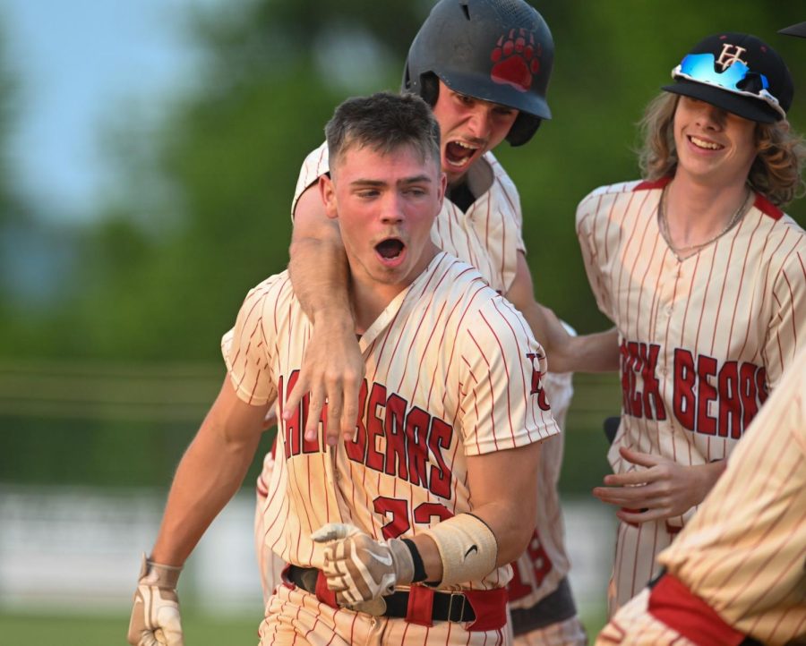 Harlan County junior outfielder Jonah Swanner celebrated with teammates after his grand slam in the fifth inning put the Bears ahead. Middlesboro scored two runs in the seventh inning to edge the Bears 10-9.