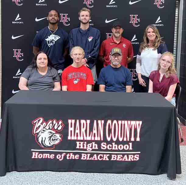 Harlan County High School senior Hunter Smith recently signed with the University of the Cumberlands. Pictured with Smith (second from left) at the signing ceremony are, from left, front row: Kathy Smith, John Smith and Callie Smith; back row: Cumberlands assistant coaches Elias Lankford and Aiden Butler, HCHS assistant coach James Miller and Harlan County High School Principal Kathy Napier.
