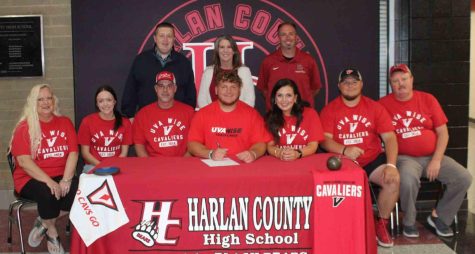 Harlan County High School senior Connor Blevins recently signed with the University of Virginia-Wise to join the school’s track program. Those pictured with Blevins at the signing include, from left, front row: Diane Frazier, Morgan Grace, Scotty Howard, Chandra Howard, Hunter Blevins and Tim Frazier; back row: Harlan County High School athletic director Eugene Farmer, HCHS Principal Kathy Napier and HCHS track coach Ryan Vitatoe.
