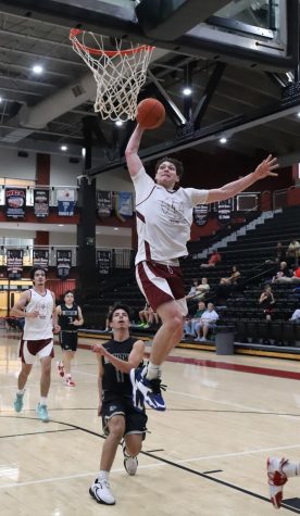 Harlan County senior guard Trent Noah sailed to the hoop for one of several dunks in scrimmage action Wednesday against South Laurel. Noah scored 29 points in the Bears 68-66 victory, then added 16 in a 96-42 win over Knox Central.