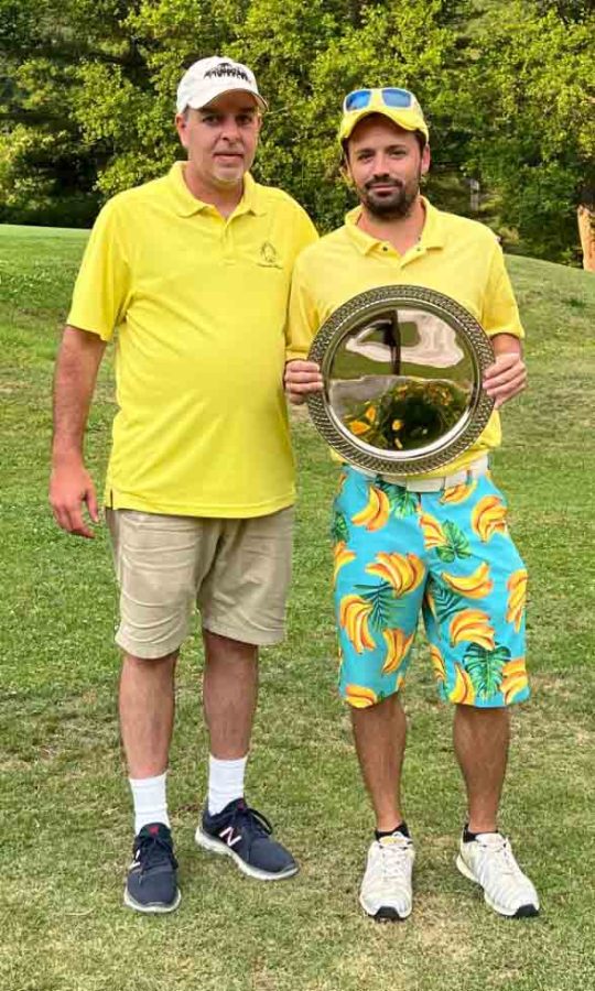 Garrett Bradley (right), of Jellico, Tenn., won the Harlan Invitational on Sunday with a three-under par 133 during the two-day tournament. Bradley was presented a trophy for the tournament championship by Harlan Country Club tournament chairman Andrew Forester.