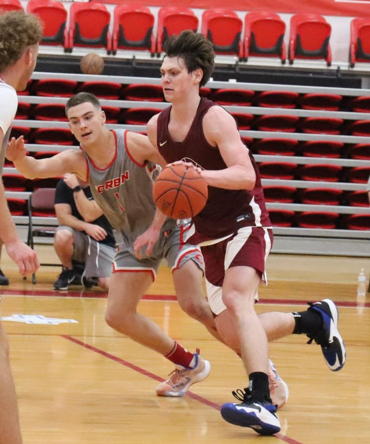 Harlan County senior guard Trent Noah raced past Corbins Noah Cima in scrimmage action Tuesday. Noah scored 21 points in a 72-64 win over Corbin and 34  points in a 93-64 victory over Barbourville.