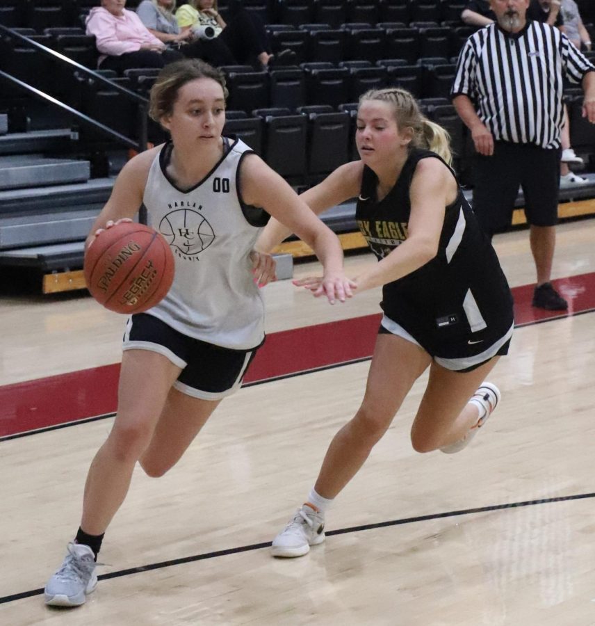 Harlan County senior Faith Hoskins drove around a Johnson Central defender in scrimmage action Wednesday.