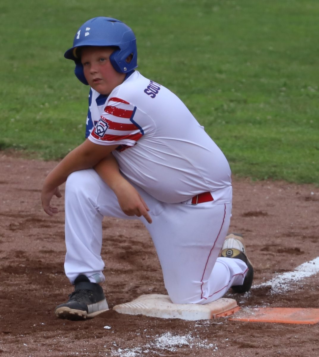 Harlan All Star Brylee Southerland took a break during a pitching change in District 4 Tournament action last week. Southerland scored the only run for Harlan in a 6-1 loss Friday to North Laurel.