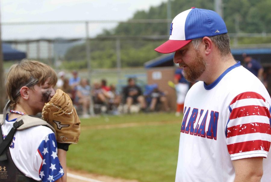 Harlan coach Sam Jenkins talked to catcher Logan Mills during District 4 Tournament action Sunday in Barbourville. Harlan will play Leslie County for second place and a berth in the district final four on Monday after falling to Hazard 7-0 on Sunday.