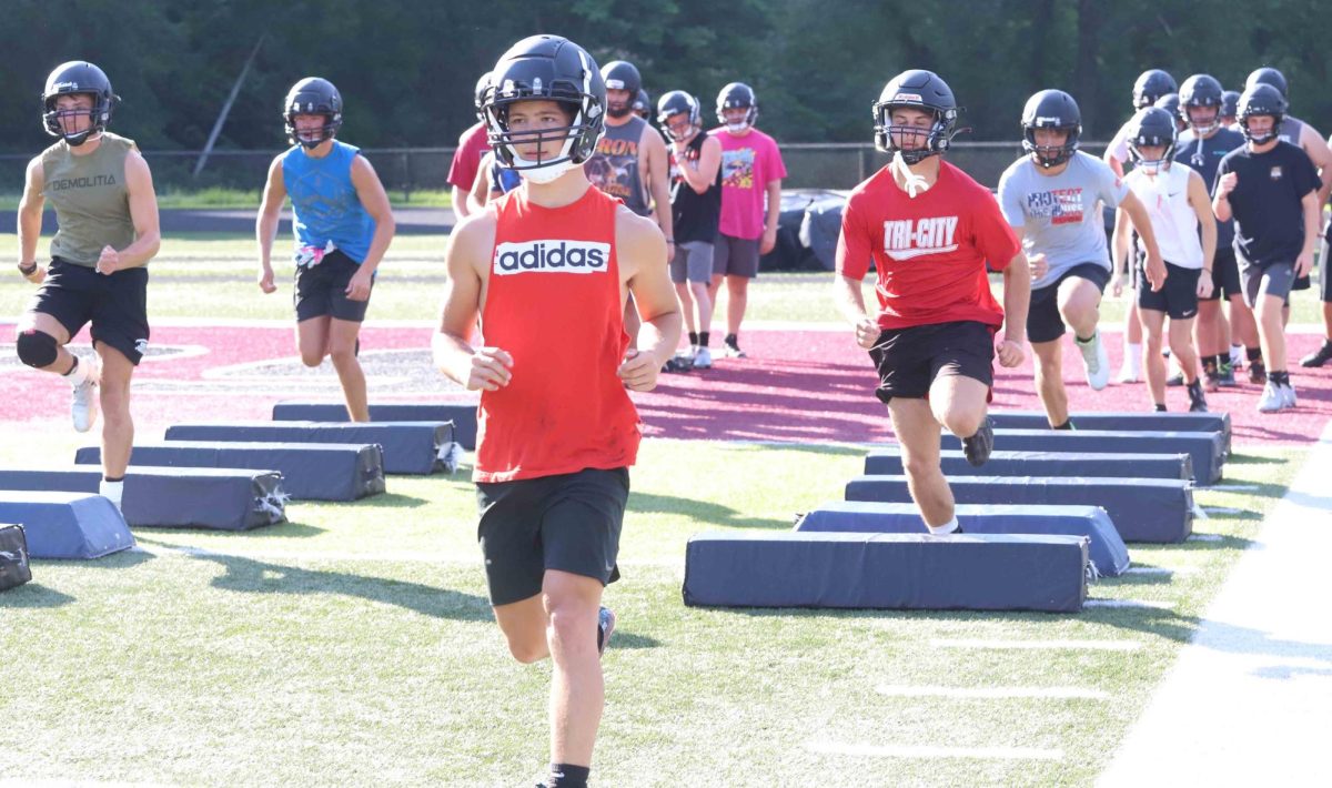 Harlan County junior receiver/defensive back Luke Kelly and the Harlan County Black Bears worked through a drill on the opening day of summer practice Monday.