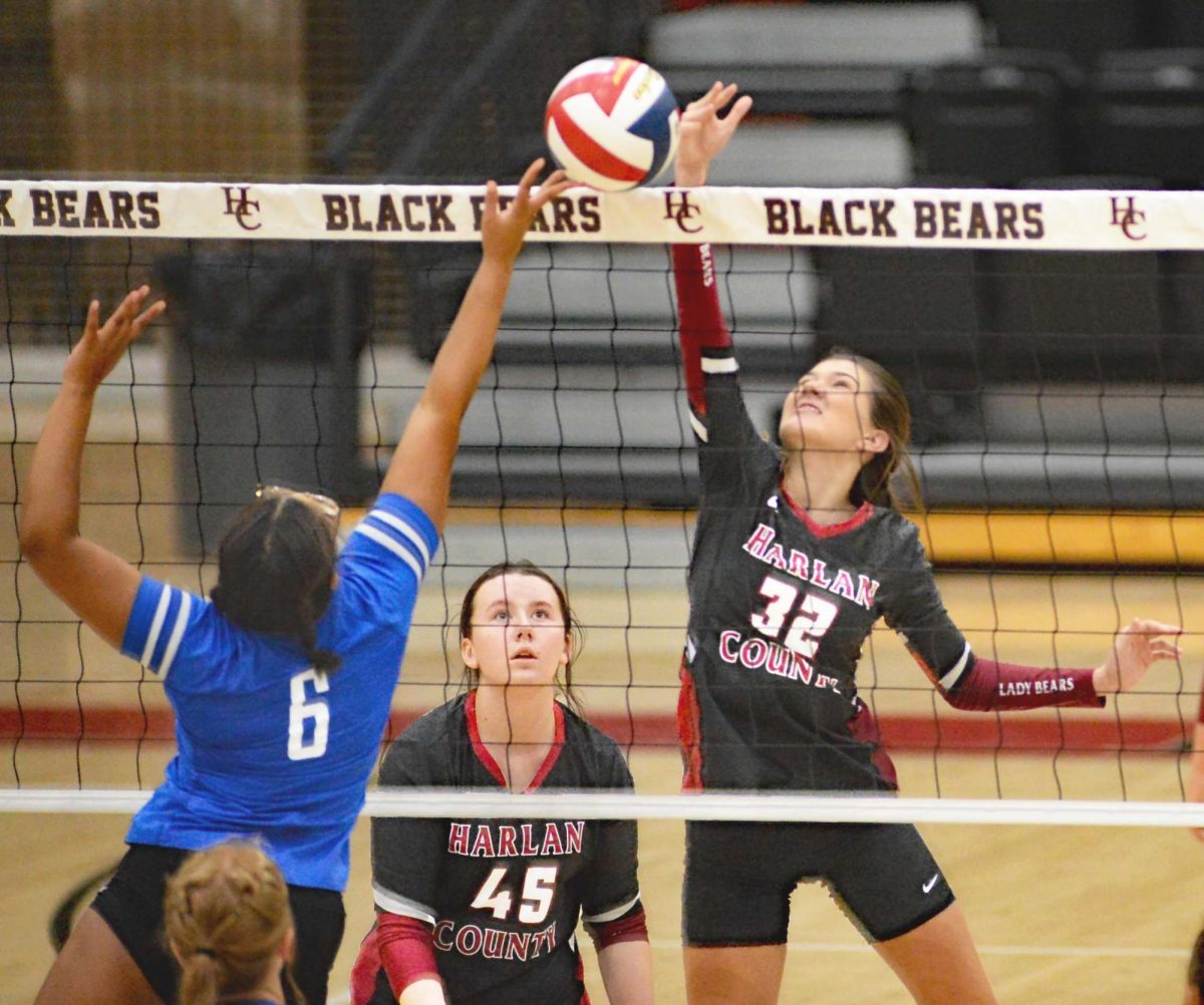 Harlan County senior Destiny Cornett battled at the net for a point in Tuesdays three-set win over visiting Barbourville. The Lady Bears improved to 3-1 with a 25-14 25-11, 25-9 victory.