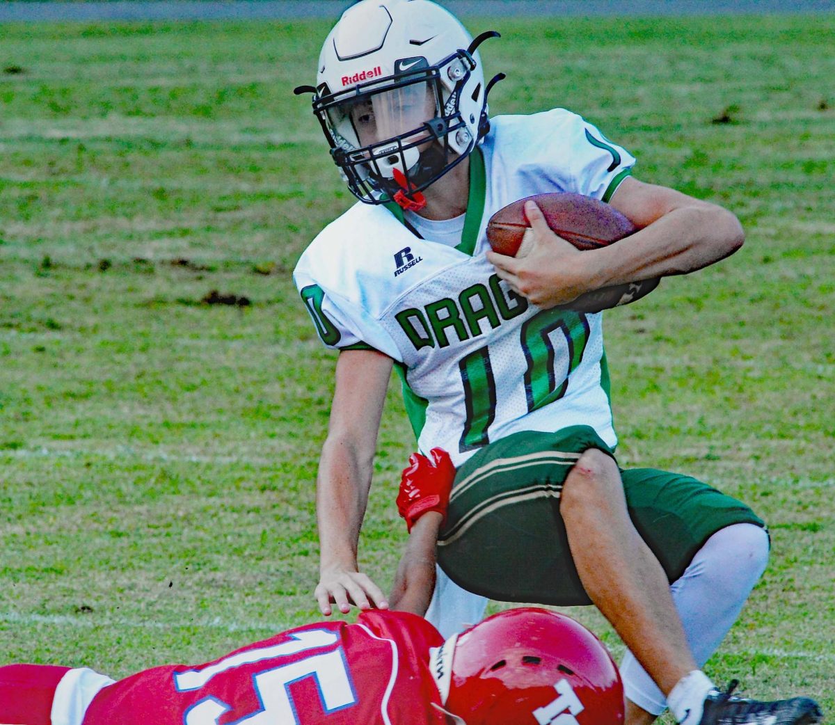 Harlan eighth-grader Jaxson Perry was brought down by a Twin Springs, Va., defender in scrimmage action Friday.