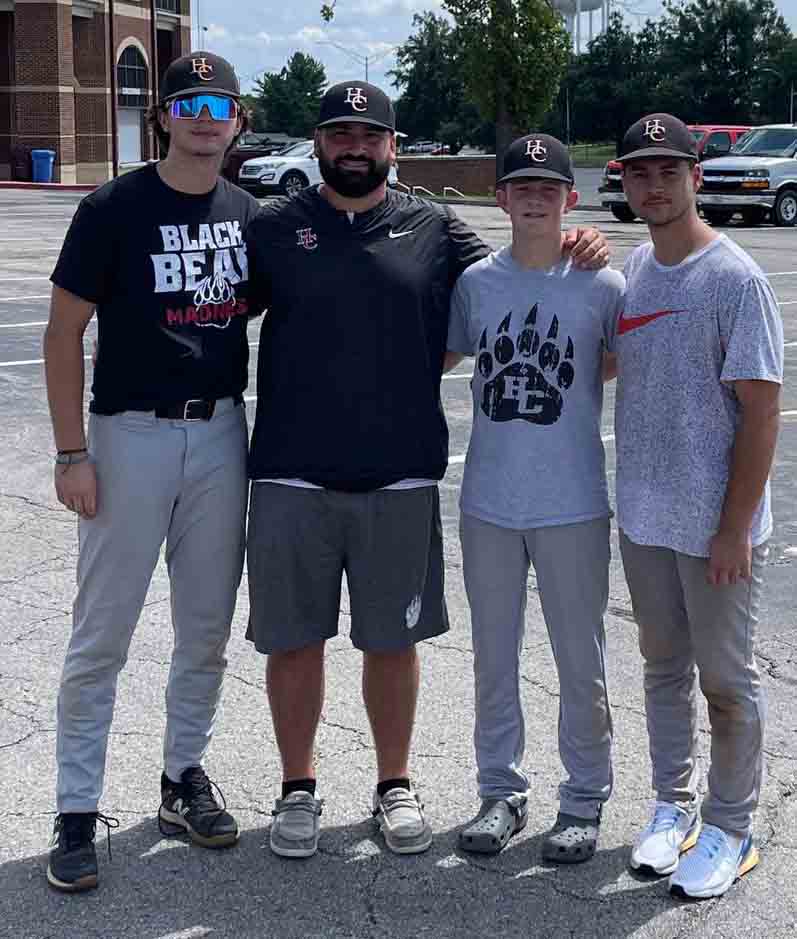 Harlan County High School baseball players Tristan Cooper, Jesse Gilbert 
and Isaac Kelly are pictured with HCHS coach Scotty Bailey during the EKU Showcase on Saturday in Richmond.