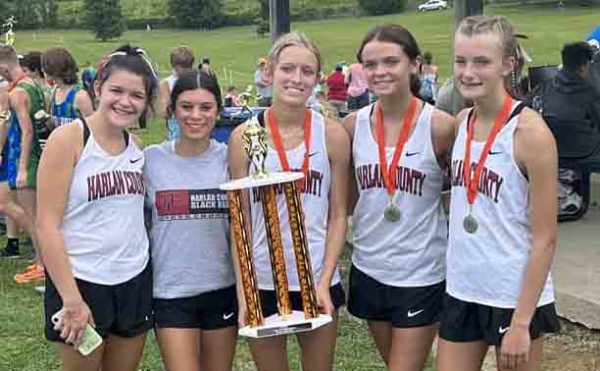 The Harlan County girls varsity team won the season-opening race on Saturday at Lynn Camp. Team members include Addi Gray, Aliyah Deleon, Peyton Lunsford, Preslee Hensley and Lauren Lewis. Olivia Kelly also participated in the race but was not pictured.