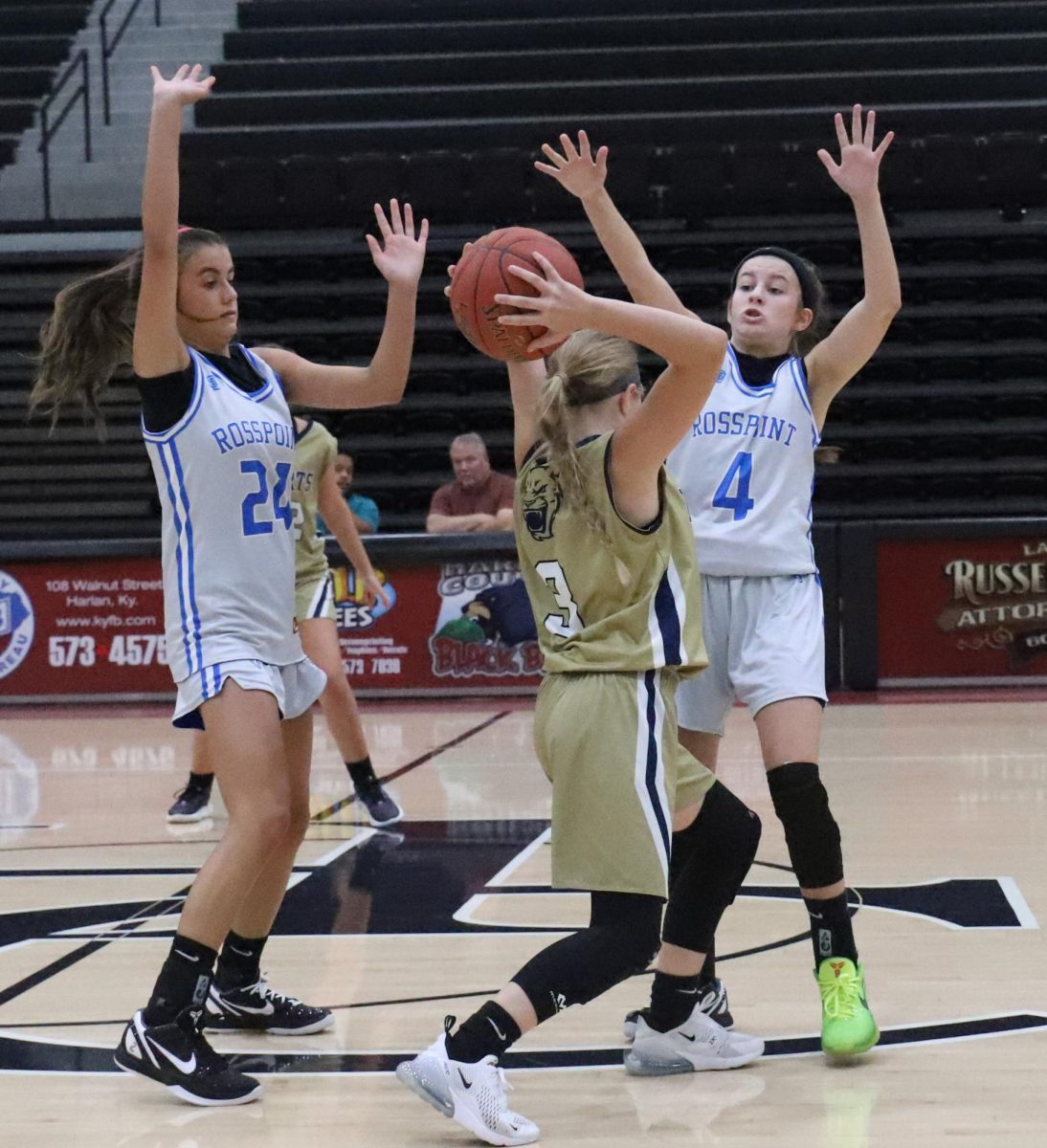Evarts Audrianna Stewart was trapped by Rosspoint guards Jaylee Cochran and Reagan Clem in action from the Harlan County Black Bears Panorama on Saturday. Cochran and Clem led the Lady Cats to a pair of victories.