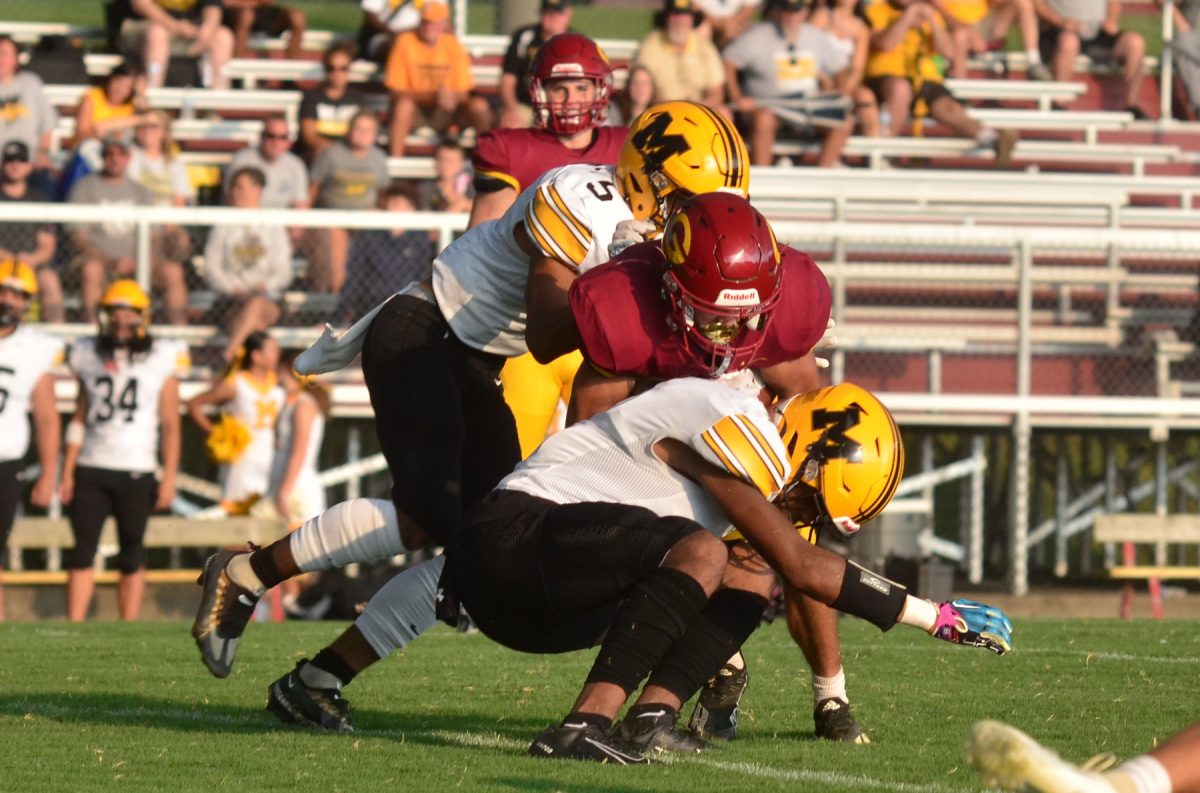 Vincent Smith (top) and Kameron Wilson teamed on a tackle in Middlesboros 14-13 win at Garrard County on Saturday.