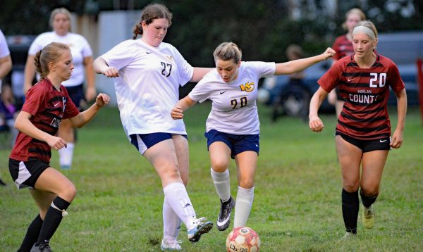 Harlan Countys Holly Wright (left) and Victoria Day (right) worked on defense in Tuesdays match against visiting Knox Central. Day broke a school record with eight goals as the Lady Bears coasted to a 10-0 victory.