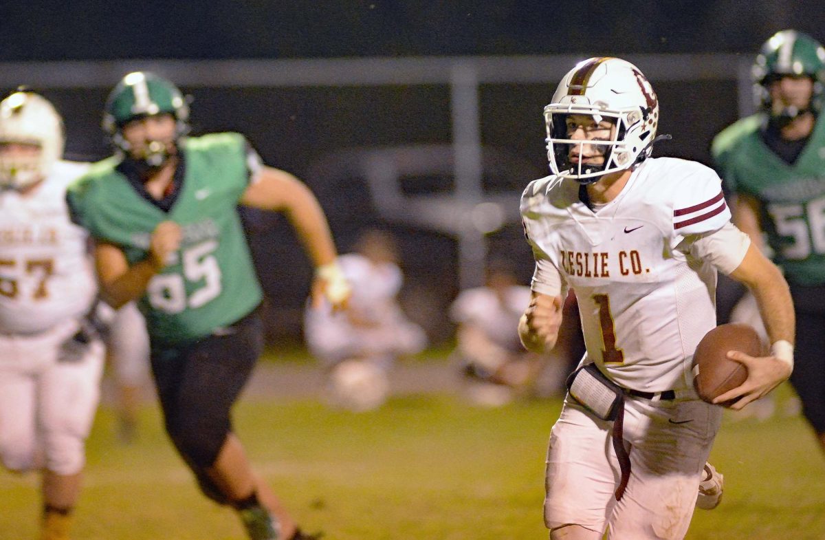 Leslie County quarterback Landry Collett picked up a big gain in Fridays 25-8 win at Harlan.