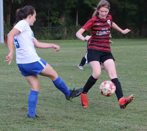 Harlan Countys Riley Witt moved the ball down the field in district soccer action. The Lady Bears rolled to a 7-0 victory.
