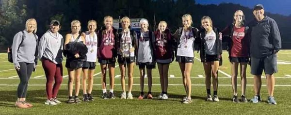 The Harlan County Lady Bears won the Sorghum Run Invitational on Tuesday at Morgan County. Team members include, from left, coaches Baili Bailey and Miranda Epperson, Charli Shepherd, Jaycee Simpson, Preslee Hensley, Peyton Lunsford, Gracie Roberts, Kiera Roberts, Lauren Lewis, Addi Gray, Olivia Kelly and coach Ryan Vitatoe.