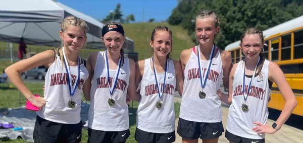 Harlan County won the girls middle school race Saturday at North Laurel High School. Team members include Charli Shepherd, Gracie Roberts, Jaycee Simpson, Lauren Lewis and Kiera Roberts.