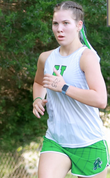 Harlan’s Chloe Schwenke, pictured in action earlier this season, placed 17th with a time of 25:29.47 to lead the varsity Lady Dragons on Saturday in Frankfort at the Capitol View Classic. Harlan finished third as a team.
