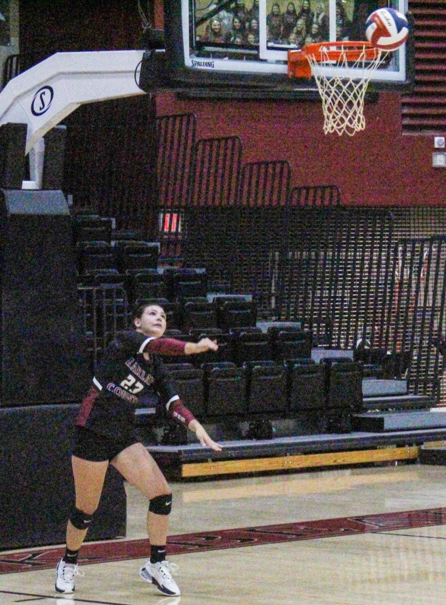 Harlan County junior Ashton Evans lofted a serve in Thursdays district victory over visiting Middlesboro.