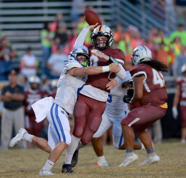 Bell County linebacker Daniel Thomas brought down McCreary Central quarterback Peyton Higginbotham in the Bobcats’ 36-7 win Friday. Thomas ran for three touchdowns and 185 yards to lead the Bell offense.